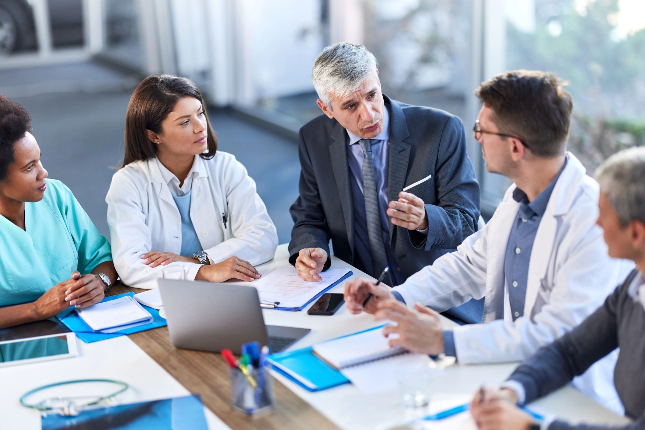 Healthcare team reviewing patient information on a computer