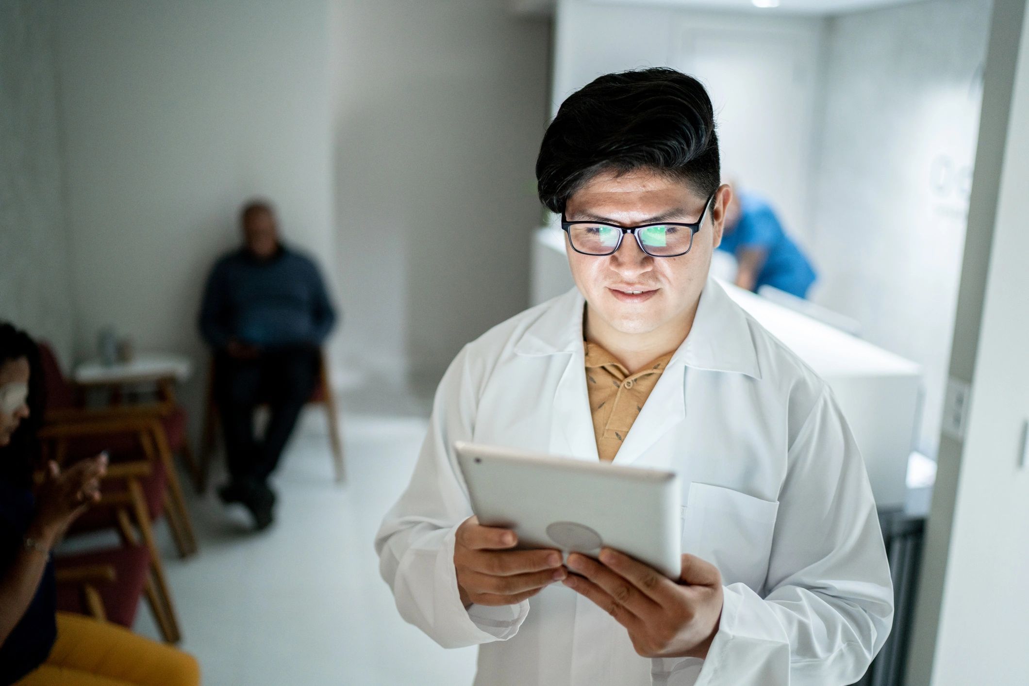 Clinician using a digital tablet in a medical clinic