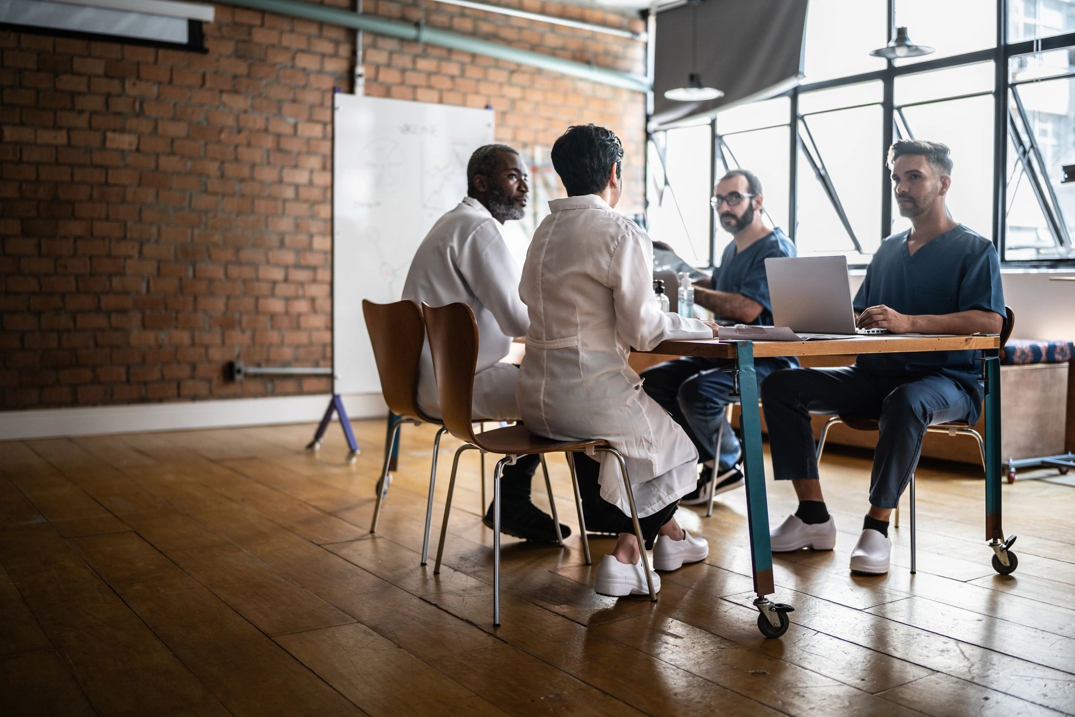 Clinicians collaborating in a medical clinic meeting