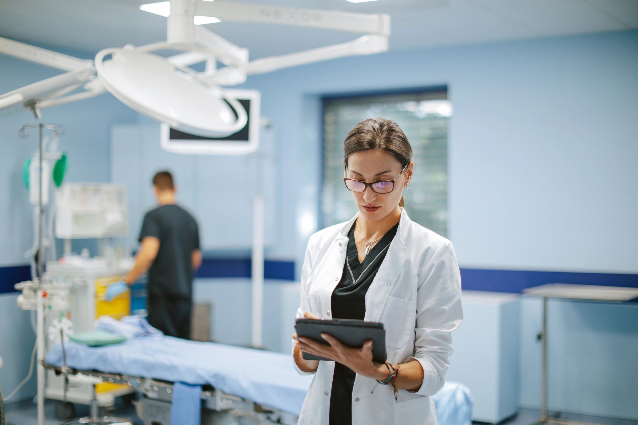 Clinician reviewing patient information on a tablet in a clinic